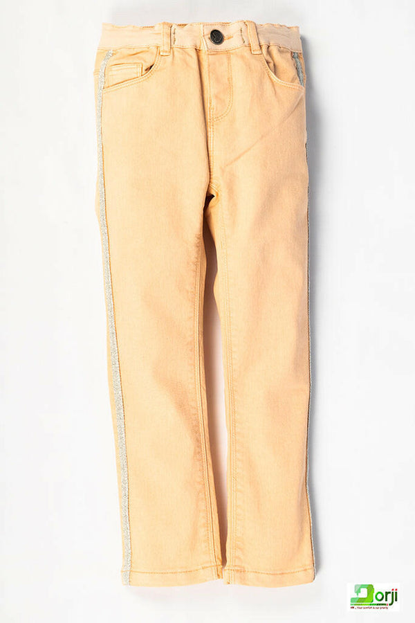 Girl's comfortable slim fit jeans in Peachy Melon colour.