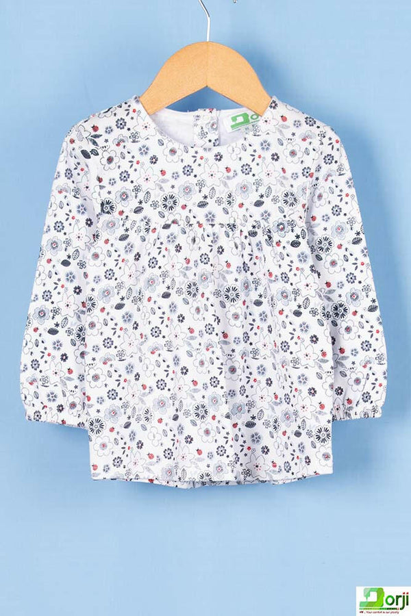 Girl's full sleeve floral dress in White.
