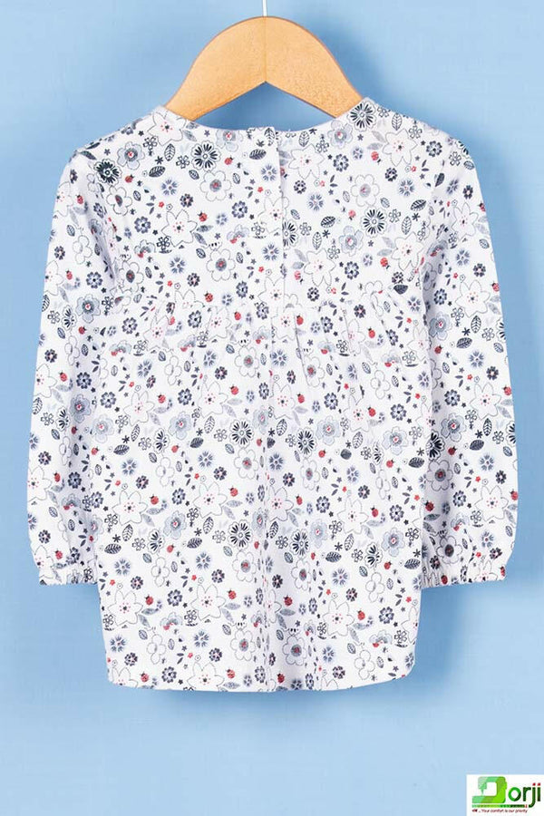 Girl's full sleeve floral dress in White.