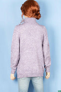 Ladies full sleeve high neck loose fit sweater.