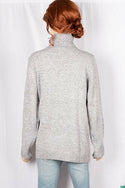 Ladies full sleeve high neck loose fit sweater.