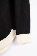 Women’s full sleeve round neck loose fit winter knit sweater.