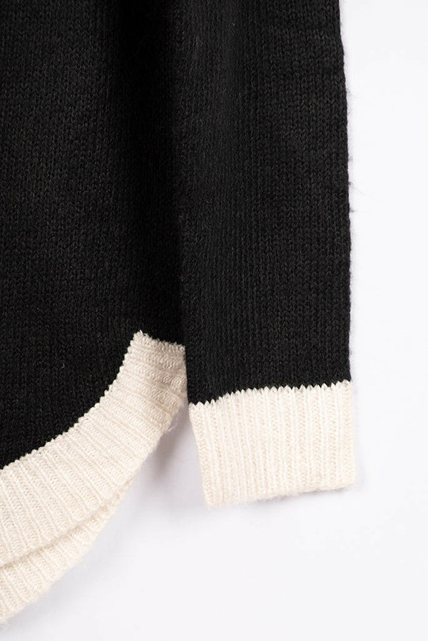 Women’s full sleeve round neck loose fit winter knit sweater.
