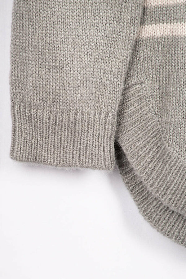Women’s full sleeve round neck loose fit winter knit sweater.