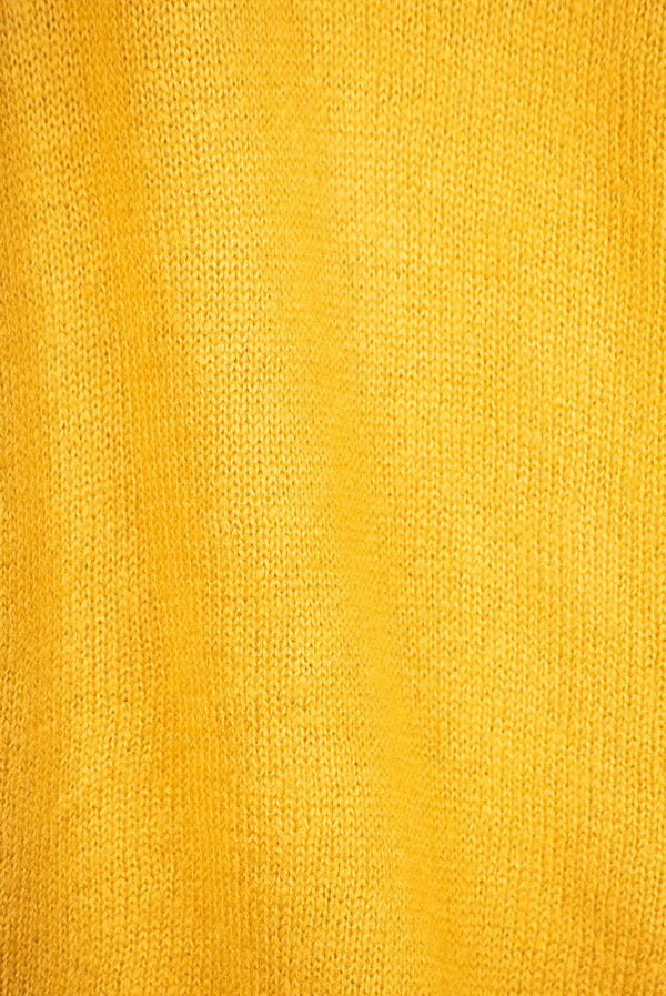 Women’s full sleeve round neck loose fit winter knit sweater.