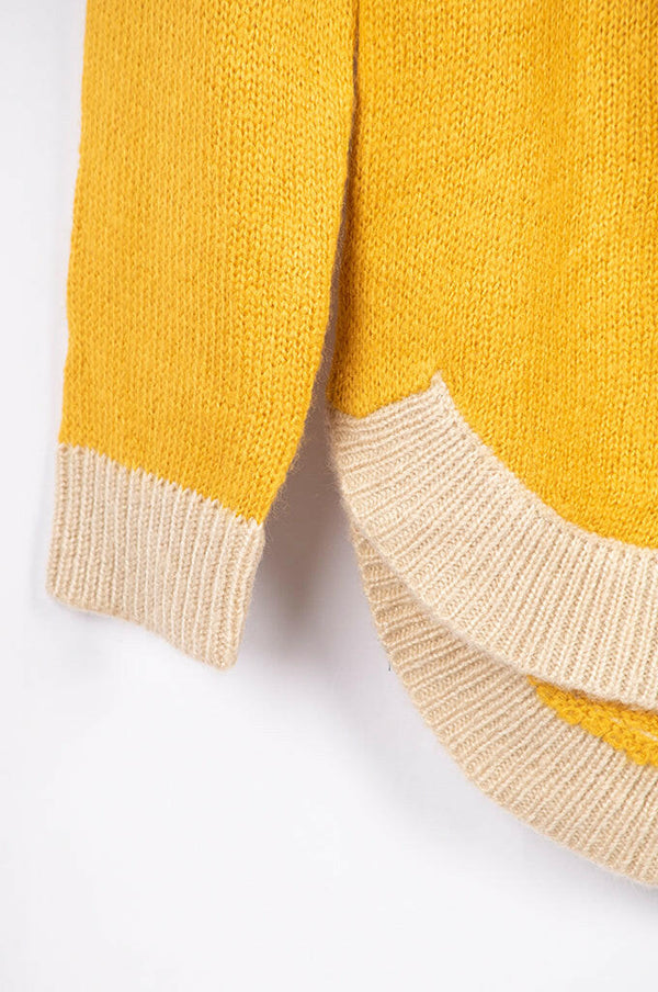 Women’s full sleeve round neck loose fit winter knit sweater.