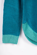 Women’s full sleeve round neck loose fit winter knit sweater.