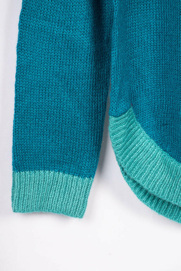 Women’s full sleeve round neck loose fit winter knit sweater.
