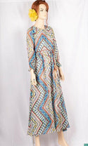 Ladies Smokey ruffles full sleeve double layered long dress in various colours print with a huge, beautiful flares and also can tie up with a fashionable belt of feather.