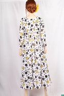Ladies Smokey ruffles full sleeve double layered long dress in various colours print with a huge, beautiful flares and also can tie up with a fashionable belt of feather.