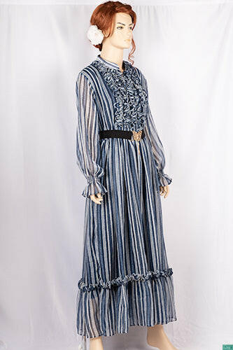 Ladies Smokey ruffles full sleeve double layered long dress with cuffed neck and ruffles chest in various colours print with a wide beautiful flare.