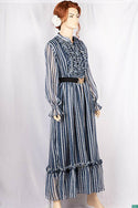 Ladies Smokey ruffles full sleeve double layered long dress with cuffed neck and ruffles chest in various colours print with a wide beautiful flare.