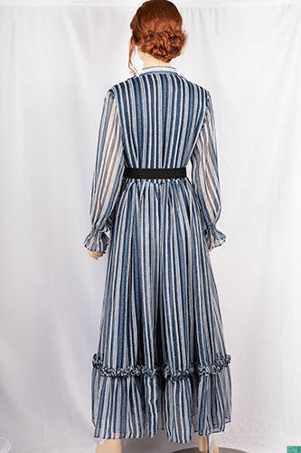Ladies Smokey ruffles full sleeve double layered long dress with cuffed neck and ruffles chest in various colours print with a wide beautiful flare.