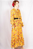 Ladies Smokey ruffles full sleeve double layered long dress with cuffed neck and ruffles chest in various colours print with a wide beautiful flare.