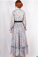 Ladies Smokey ruffles full sleeve double layered long dress with cuffed neck and ruffles chest in various colours print with a wide beautiful flare.