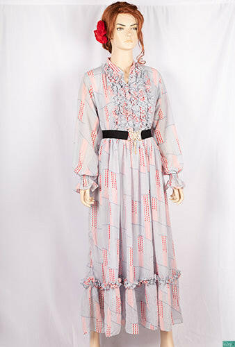 Ladies Smokey ruffles full sleeve double layered long dress with cuffed neck and ruffles chest in various colours print with a wide beautiful flare.