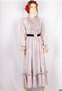Ladies Smokey ruffles full sleeve double layered long dress with cuffed neck and ruffles chest in various colours print with a wide beautiful flare.
