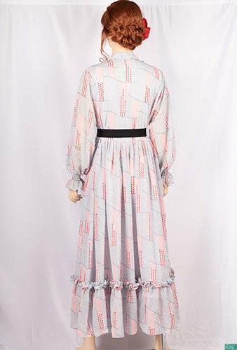 Ladies Smokey ruffles full sleeve double layered long dress with cuffed neck and ruffles chest in various colours print with a wide beautiful flare.
