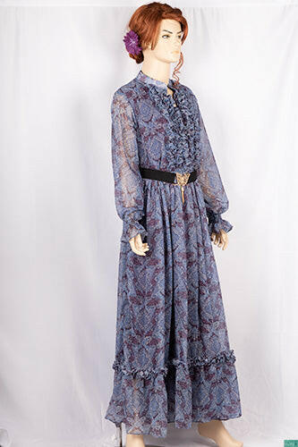 Ladies Smokey ruffles full sleeve double layered long dress with cuffed neck and ruffles chest in various colours print with a wide beautiful flare.