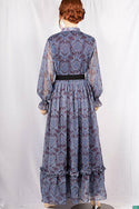 Ladies Smokey ruffles full sleeve double layered long dress with cuffed neck and ruffles chest in various colours print with a wide beautiful flare.