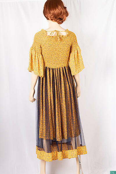 Ladies double layered long frock dress in various colours floral print with 3/4 Smokey ruffles sleeves and stretchy Smokey body.