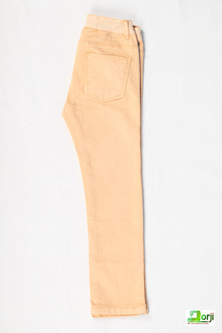 Girl's comfortable slim fit jeans in Peachy Melon colour.