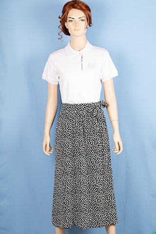 Ladies casual fit mid length stylish double part skirts with pockets in White spotty print on black.