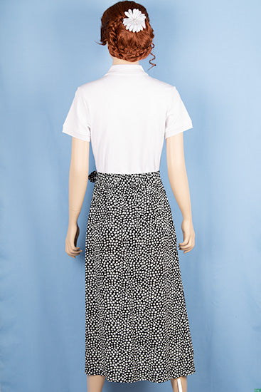 Ladies casual fit mid length stylish double part skirts with pockets in White spotty print on black.