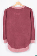 Women’s full sleeve round neck loose fit winter knit sweater.