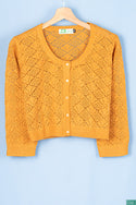 Ladies net design round neck full sleeve soft light Cardigan in mustard yellow.